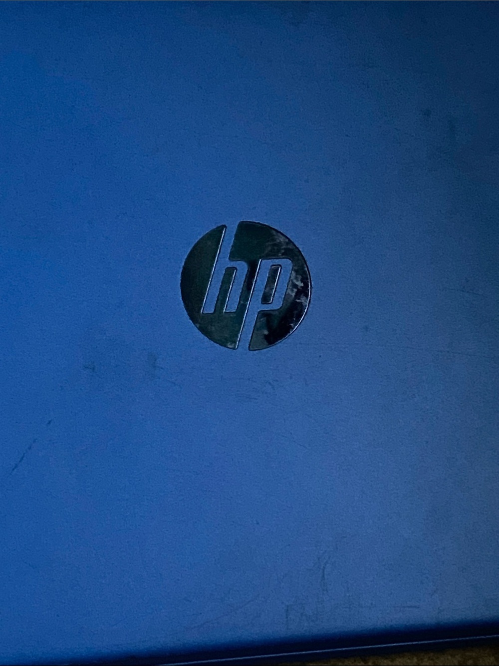 HP Blue Laptop with Silver Logo